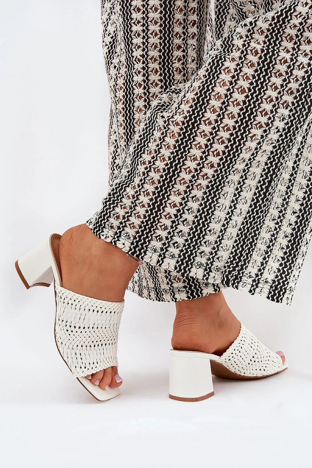 Women's slippers with a braid