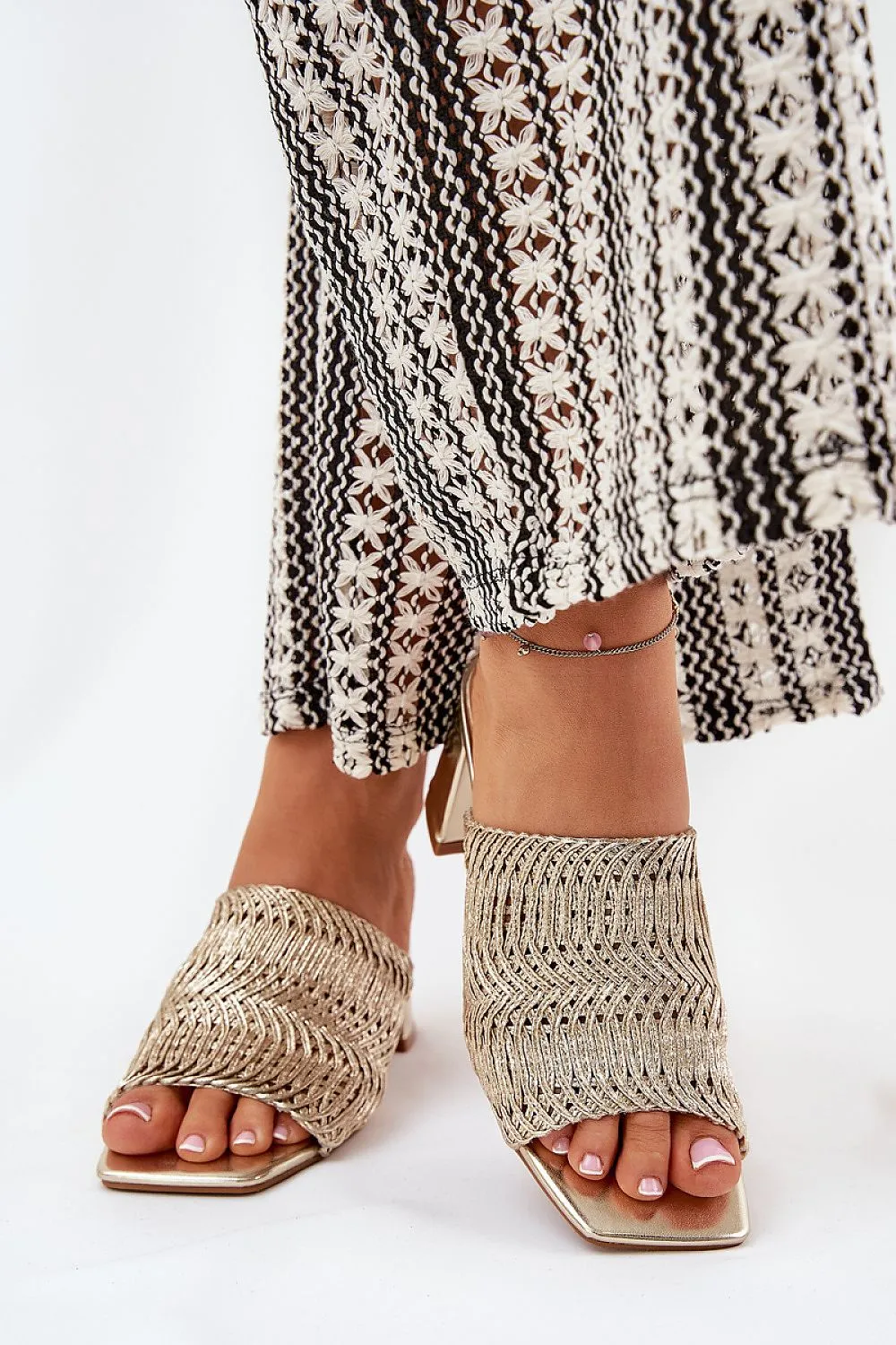 Women's slippers with a braid