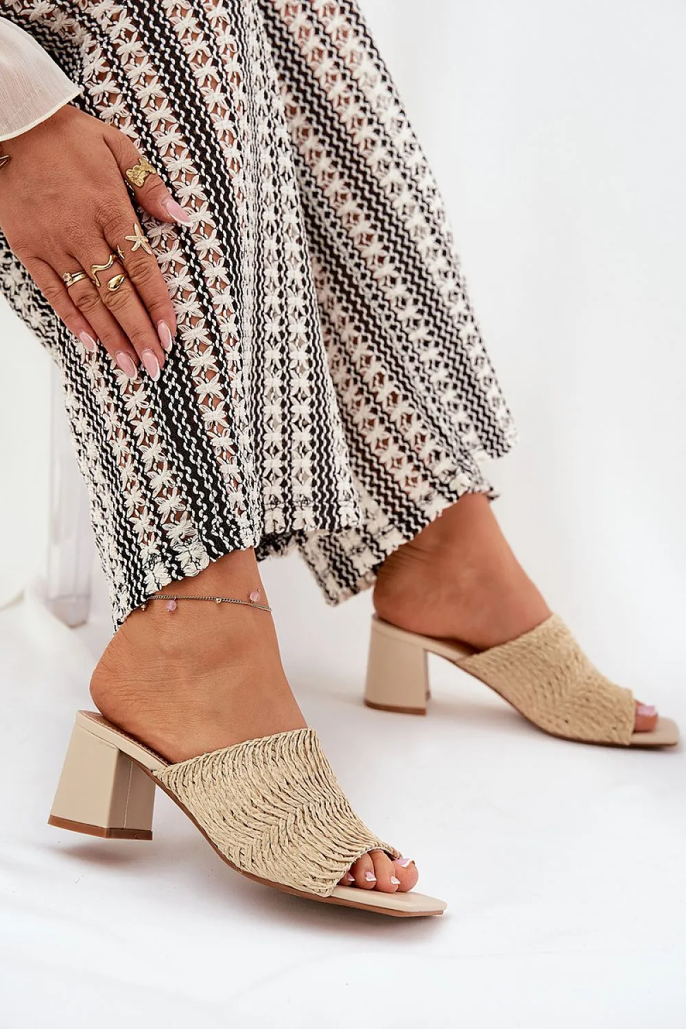 Women's slippers with a braid