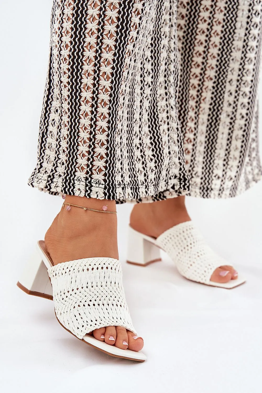 Women's slippers with a braid
