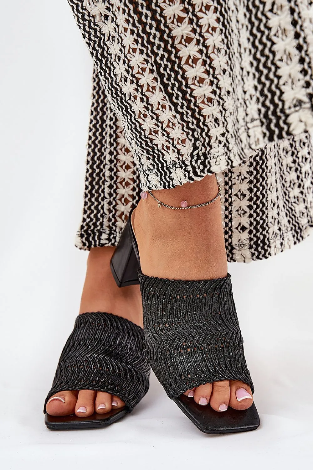 Women's slippers with a braid