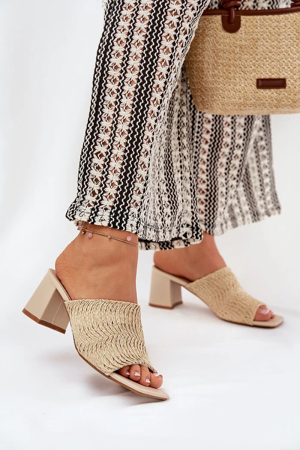Women's slippers with a braid